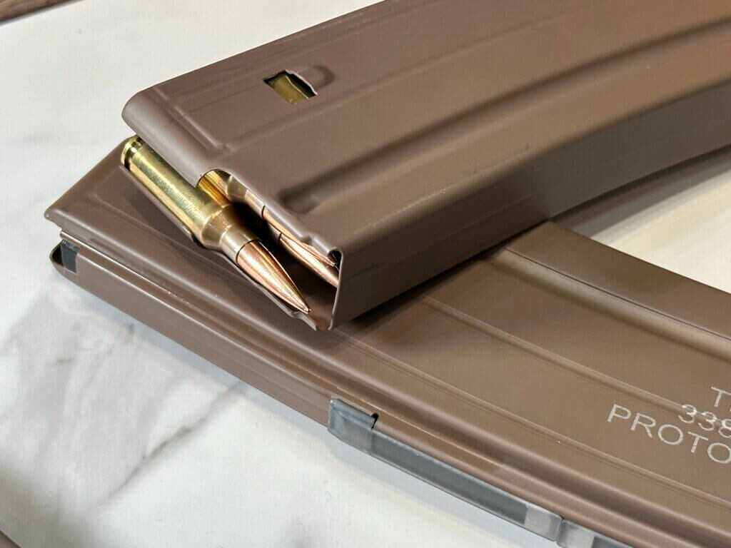 A magazine faces us, showing how the bullets stack.