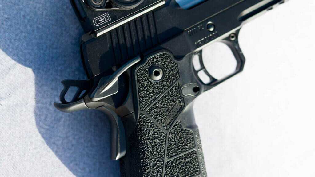 Close up view of the right side of the upper grip and receiver showing the and safety.