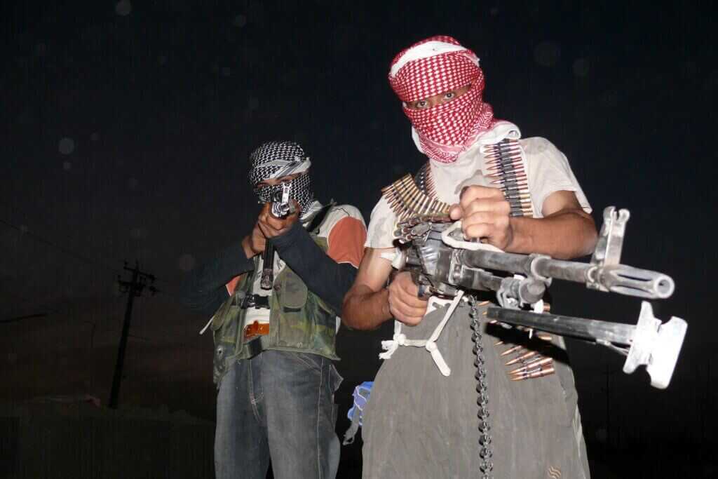 Iraqi insurgents with rifles representing militia threats tied to Al Jameat Police Station and Operation Sinbad
