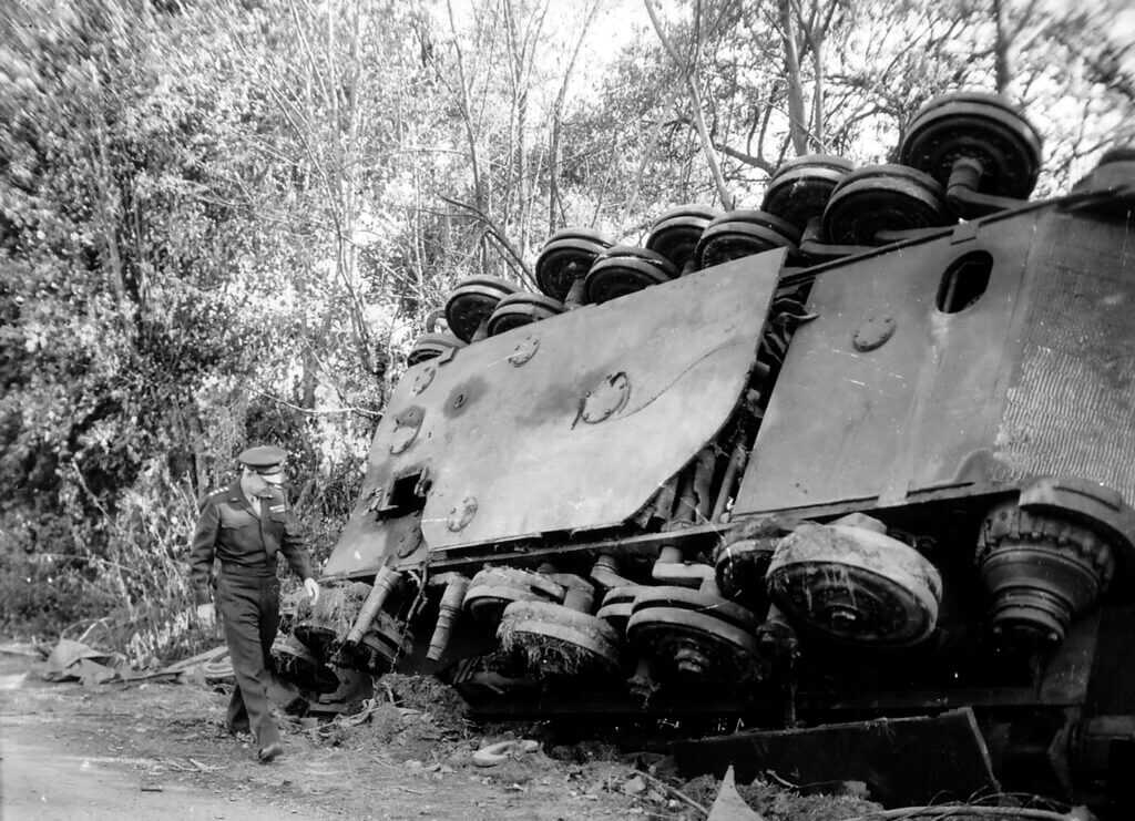 Destroyed Tiger II inspected by General Eisenhower after an Allied air attack, showing the heavy tank's vulnerability once immobilized