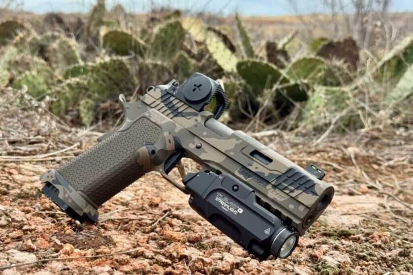 Custom Stealth Arms Platypus pistol with porting, Cerakote finish, optic, and weaponlight setup