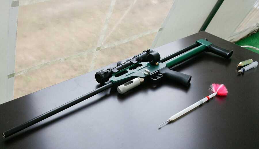 tranquilizer gun with dart system used to deliver sedative drugs remotely