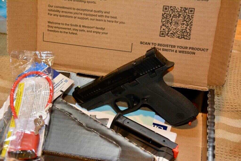 Smith & Wesson M&P Shield X package contents with magazines lock chamber flag manual and factory box
