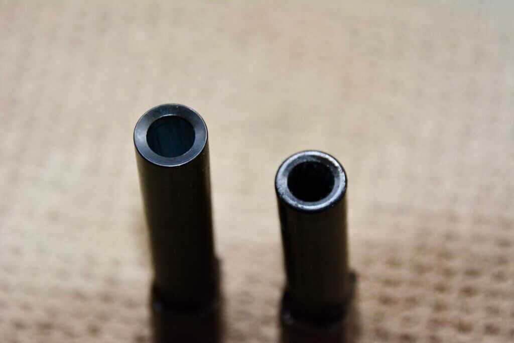 Smith & Wesson M&P Shield X barrel on left compared beside Shield Plus barrel on right