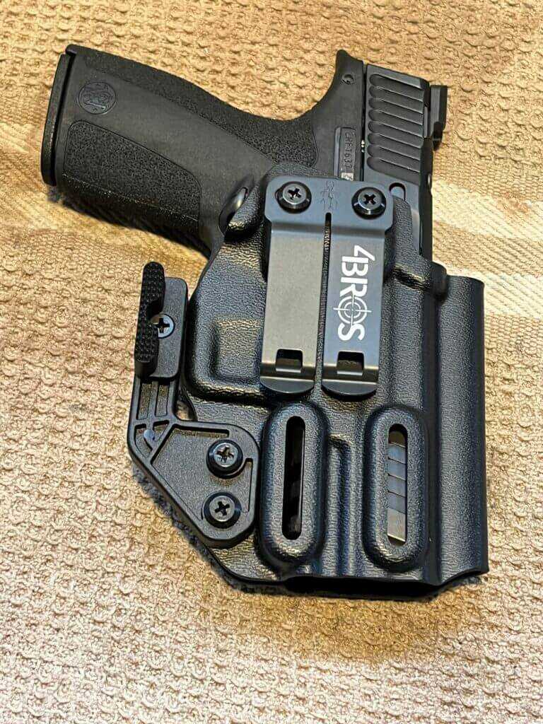 Smith & Wesson M&P Shield X holstered in a Four Brothers appendix carry holster