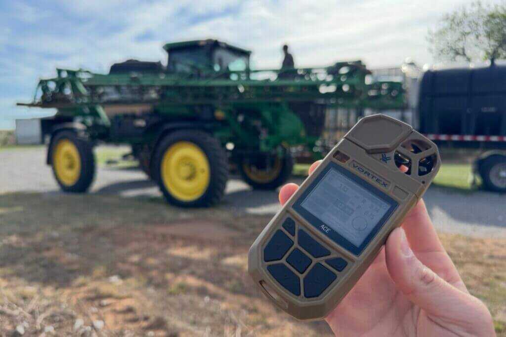 Using the Vortex ACE weather meter to check environmental conditions before farm spraying
