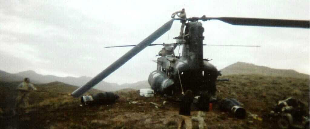Task Force 160 maintenance crew cutting MH-47E rotor blades off with a saw during field recovery