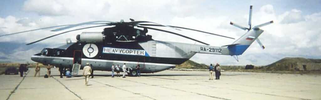 Soviet-era Mi-26 heavy-lift helicopter carrying the ruined Chinook out of the Afghan mountains