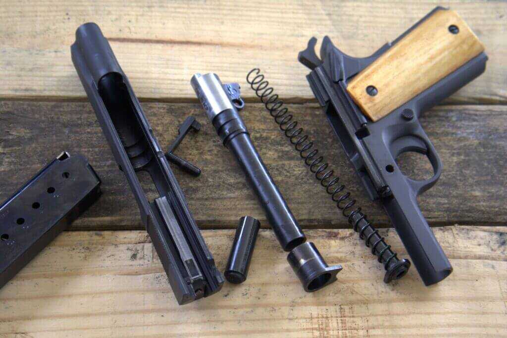Rock Island Armory GI Standard 1911 disassembled for field strip showing barrel and slide