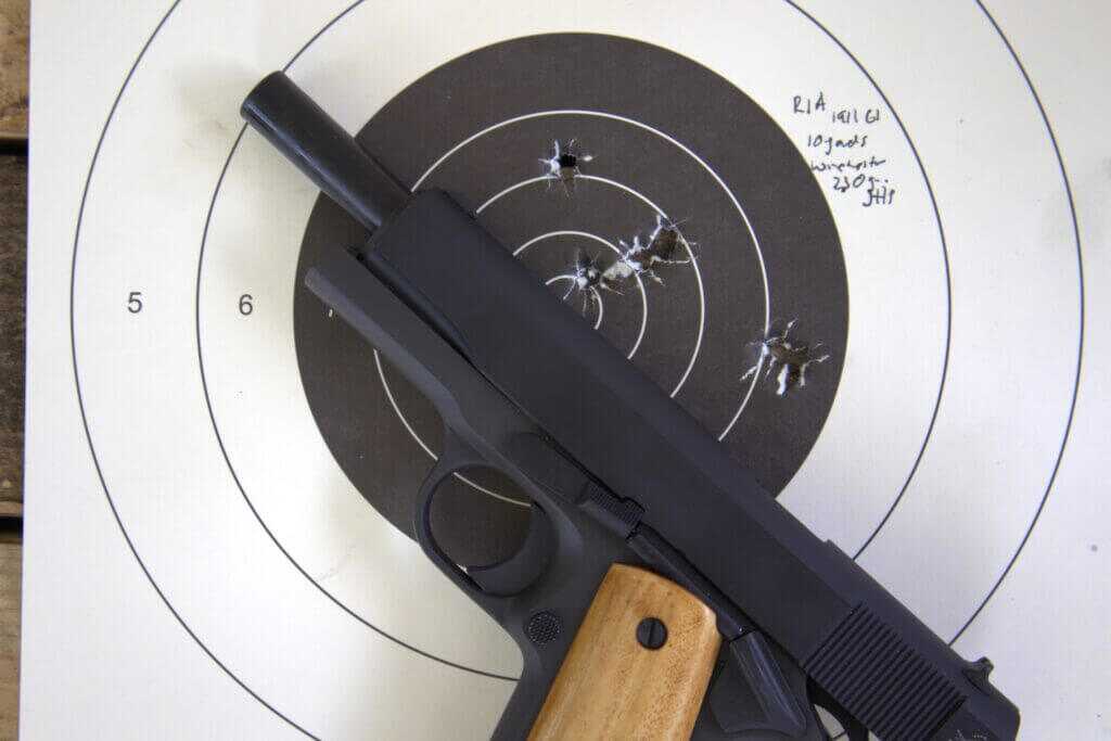 Rock Island Armory GI Standard 1911 with target during accuracy testing