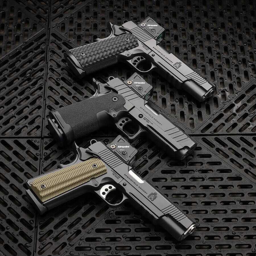 Springfield Armory 1911 DS Prodigy and TRP pistols equipped with Aimpoint COA enclosed-emitter optics.