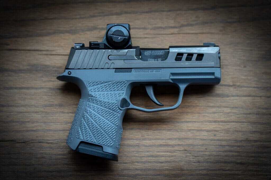 SIG P365 concealed carry pistol with optics-ready slide and Wilson Combat grip module