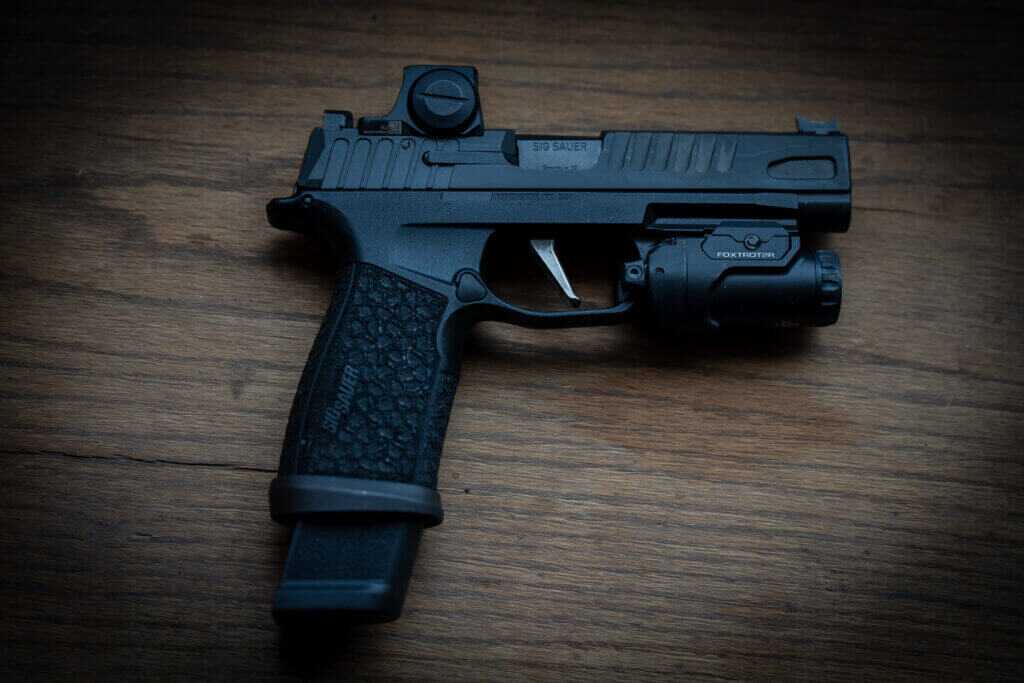 SIG P365 Fuse with 21 round magazine showing extended capacity in slim carry pistol