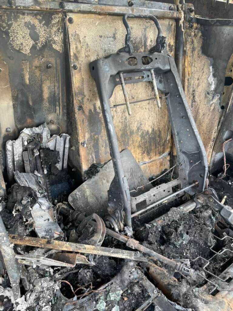 The destroyed interior of a Houston Police patrol vehicle after a pursuit crash and fire.