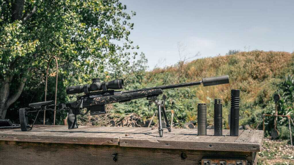 Airlock Zero Gravity 6.5 suppressor mounted on Seekins Element Hunter beside SilencerCo Scythe Ti and Omega 300