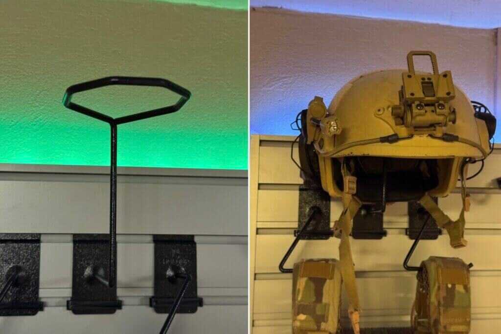 Helmet secured on a Hold Up Displays helmet mount in a custom safe-room gun wall setup