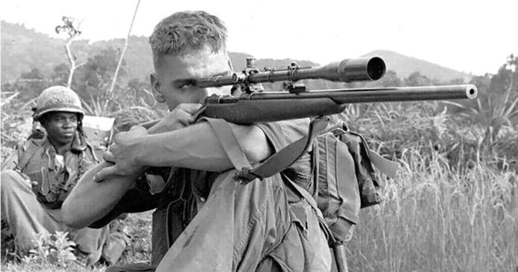 Gunnery Sergeant Carlos Hathcock with a Winchester Model 70 sniper rifle