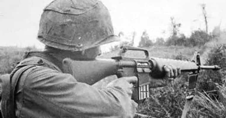 M16A1 rifle used in Vietnam War with triangular handguard and duck bill muzzle device