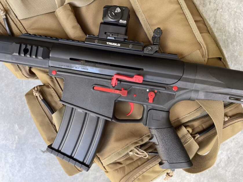 Left side of Tokarev TT 12 Pro showing slim handguard and oversized shotgun controls