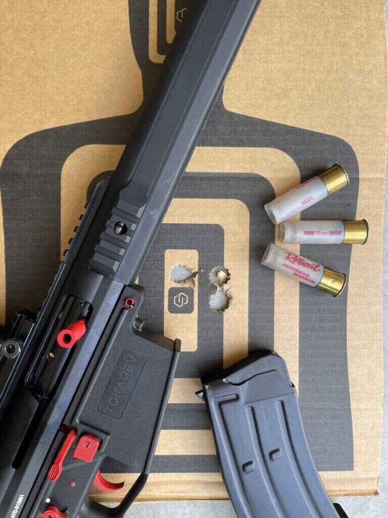 Tokarev TT 12 Pro slug accuracy target with 1.5-inch 3-shot groups at 25 yards