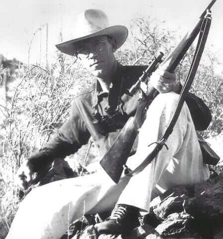 Jack O'Connor holding a Winchester Model 70 rifle in .270 Winchester