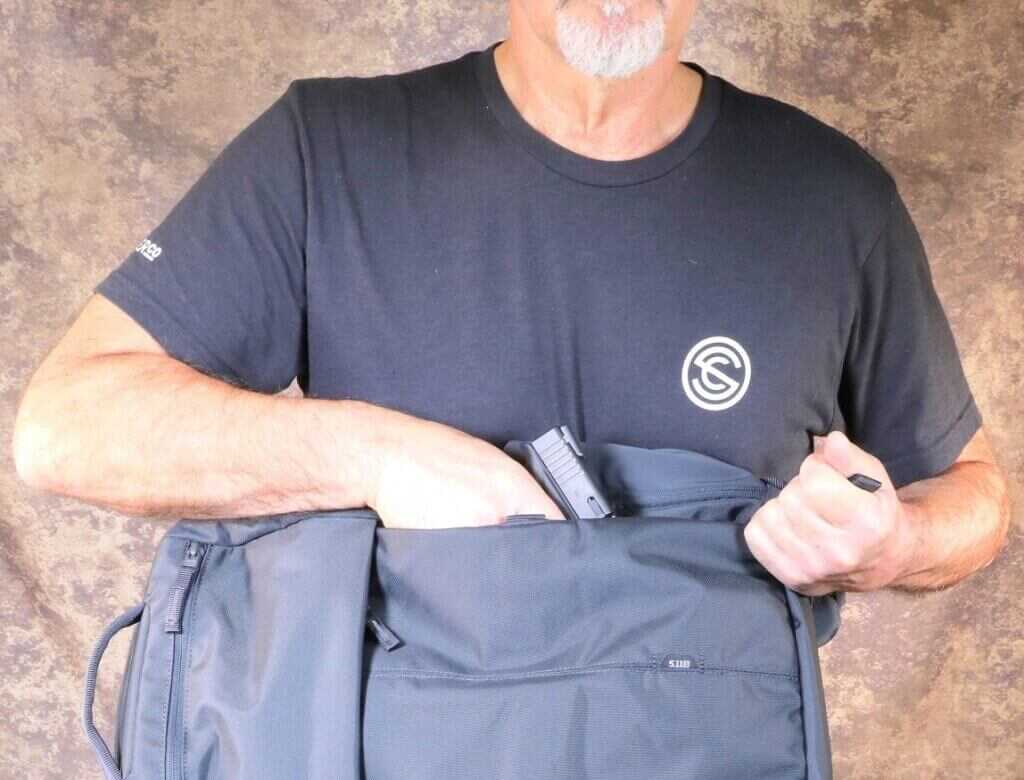 5.11 LVC12 concealed carry backpack draw practice with laser equipped pistol trainer