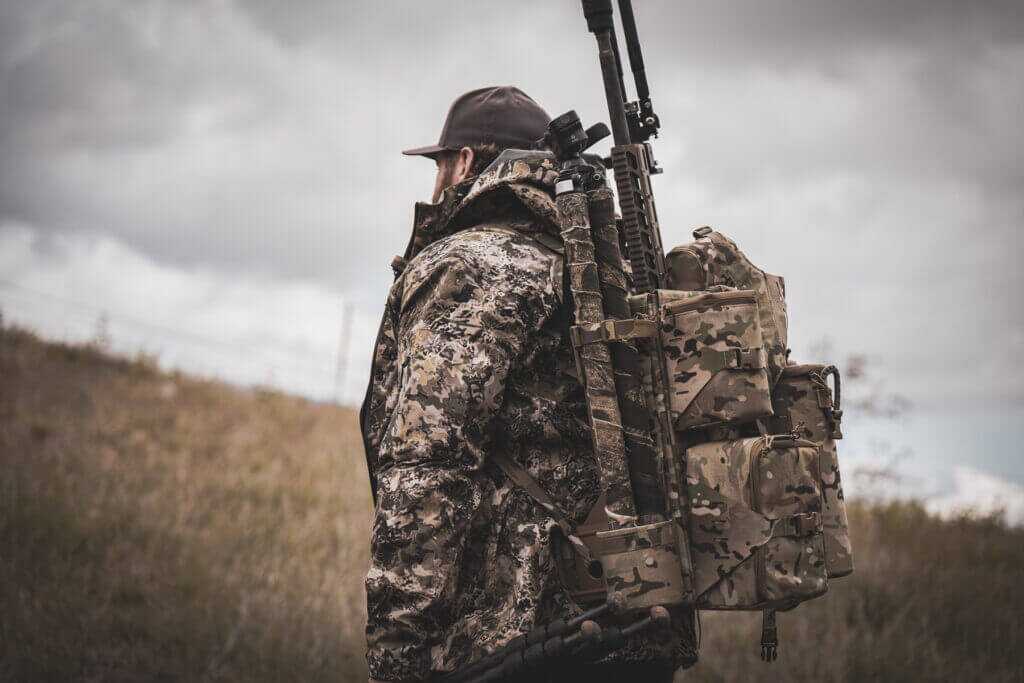 Suppressed rifle carried muzzle-up inside the Tracer Tactical Burro rifle pack
