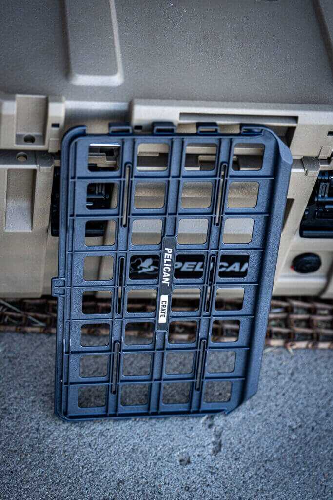 Pelican CRATE 45L divider panel showing attachment options for pouches and modular gear organization