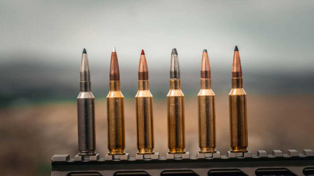 Federal 6.5 Creedmoor +Peak steel case ammunition beside traditional brass 6.5 Creedmoor cartridges