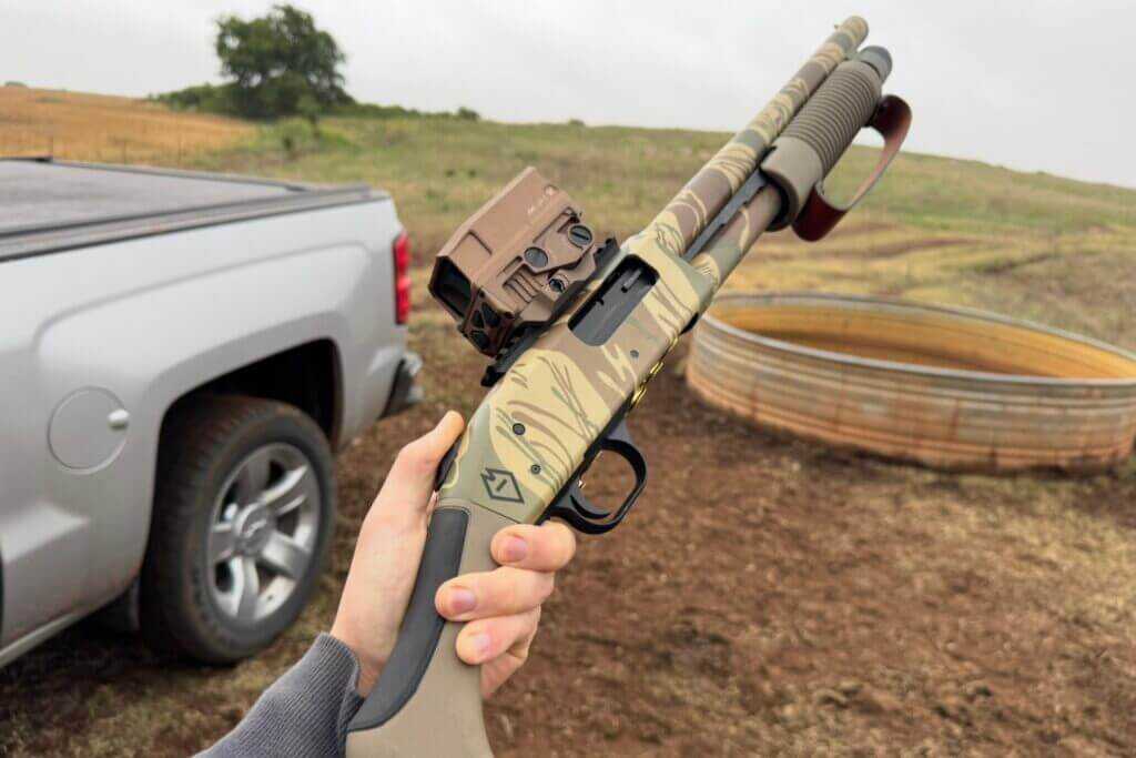 Mossberg 590 Bliksem compact 12-gauge firearm showing non-NFA configuration and bird’s head grip
