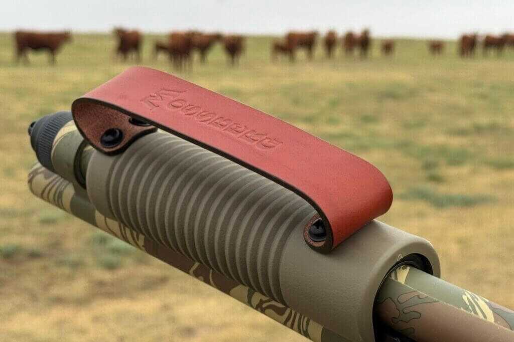 Leather retention strap on the Mossberg 590 Bliksem corncob forend for support-hand control