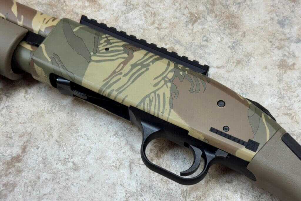 Rhodesian Brushstroke camo finish on the Mossberg 590 Bliksem receiver and barrel