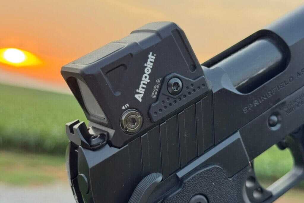 Two rear sight screws locking the Aimpoint COA into the Springfield Prodigy A-CUT mount