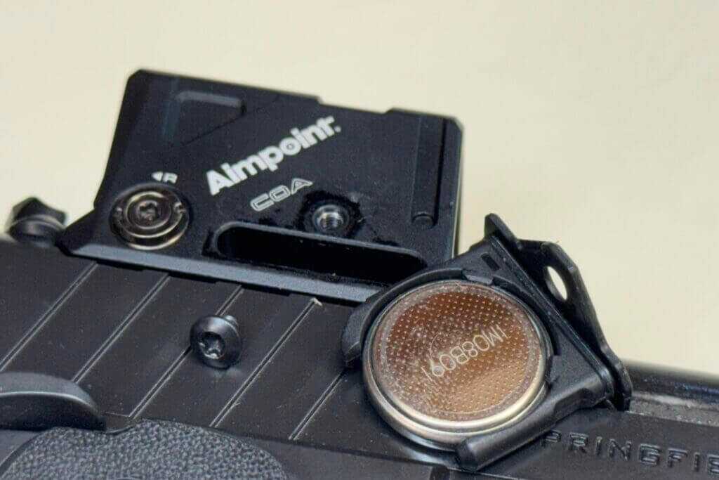 Removable Aimpoint COA battery tray secured by a single set screw