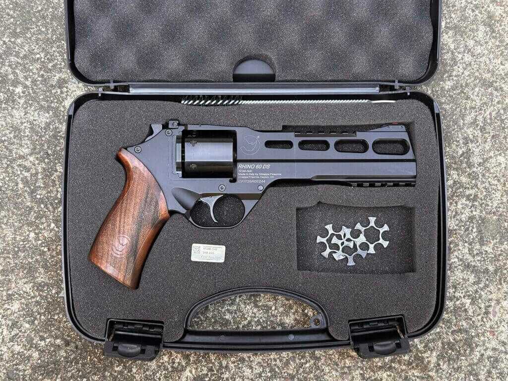 Chiappa Rhino 60 DS 10mm revolver in a foam-lined hard case with moon clips, trigger lock, brush, and paperwork