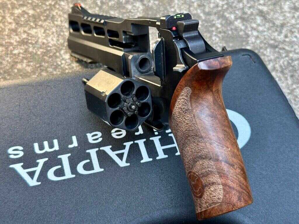 Open cylinder view of the Chiappa Rhino 60 DS 10mm showing the low breech position aligned with the shooter's hand