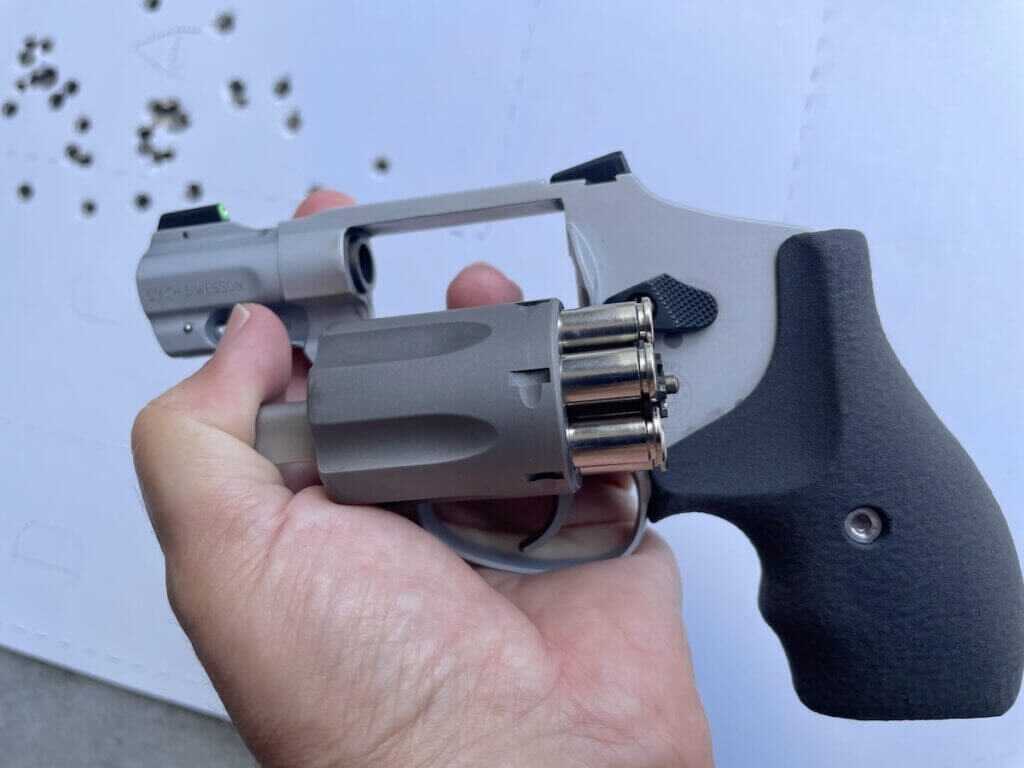 Empty cartridge cases being ejected from the S&W 632 titanium cylinder during range testing