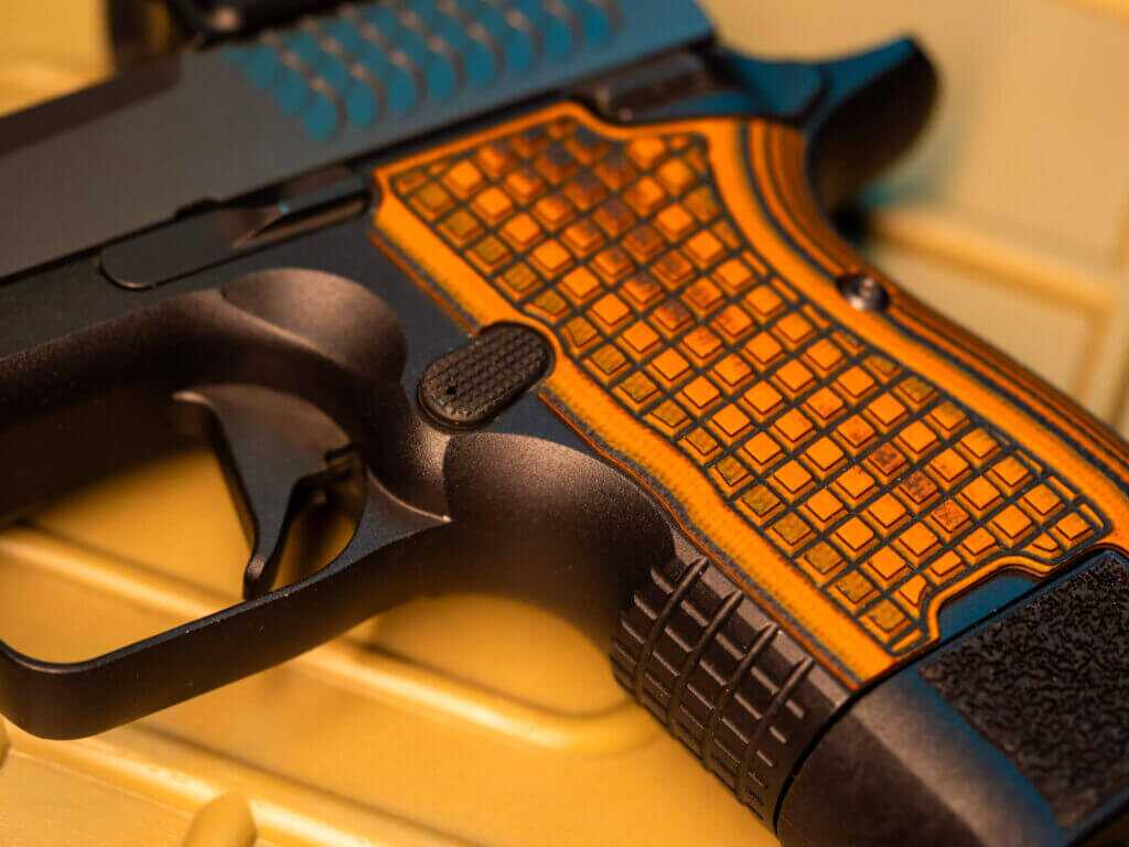 Kimber CDS9 G10 VZ frag grips magazine release and matching textured front strap