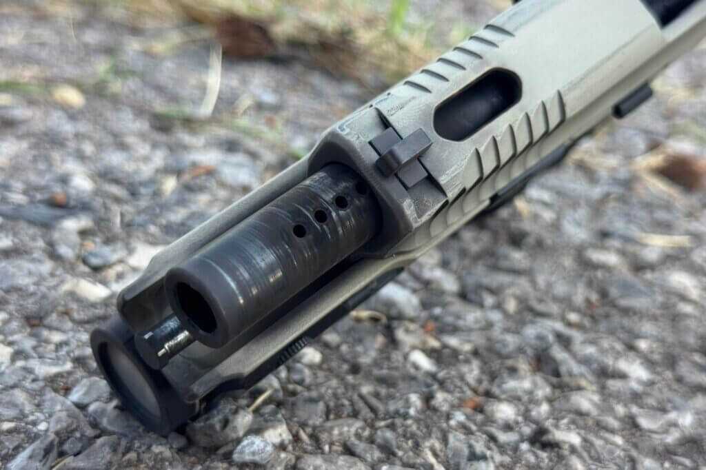 Four barrel ports visible through the S&W Spec Series VI M&P 9 slide cut