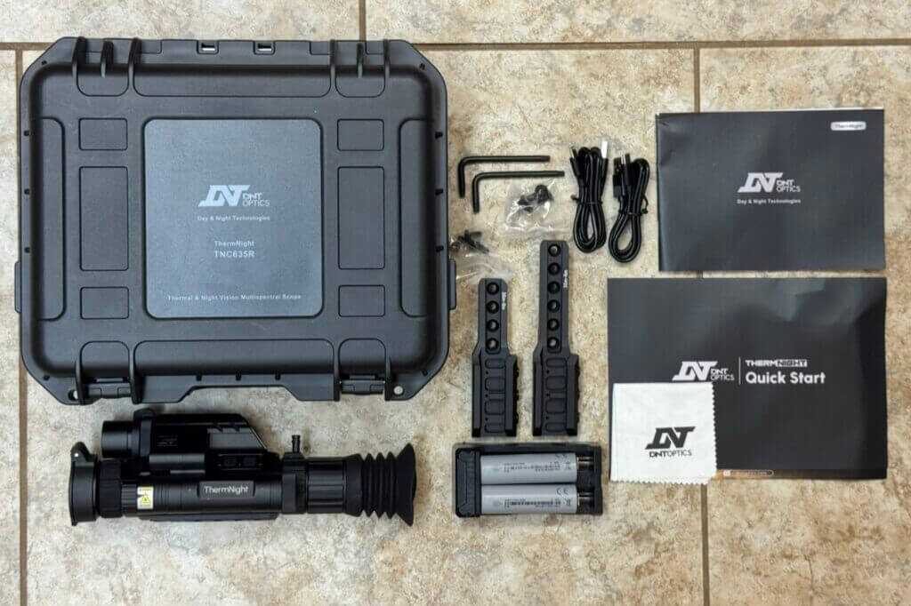DNT TNC635R scope and included batteries charger mounts cables and accessories