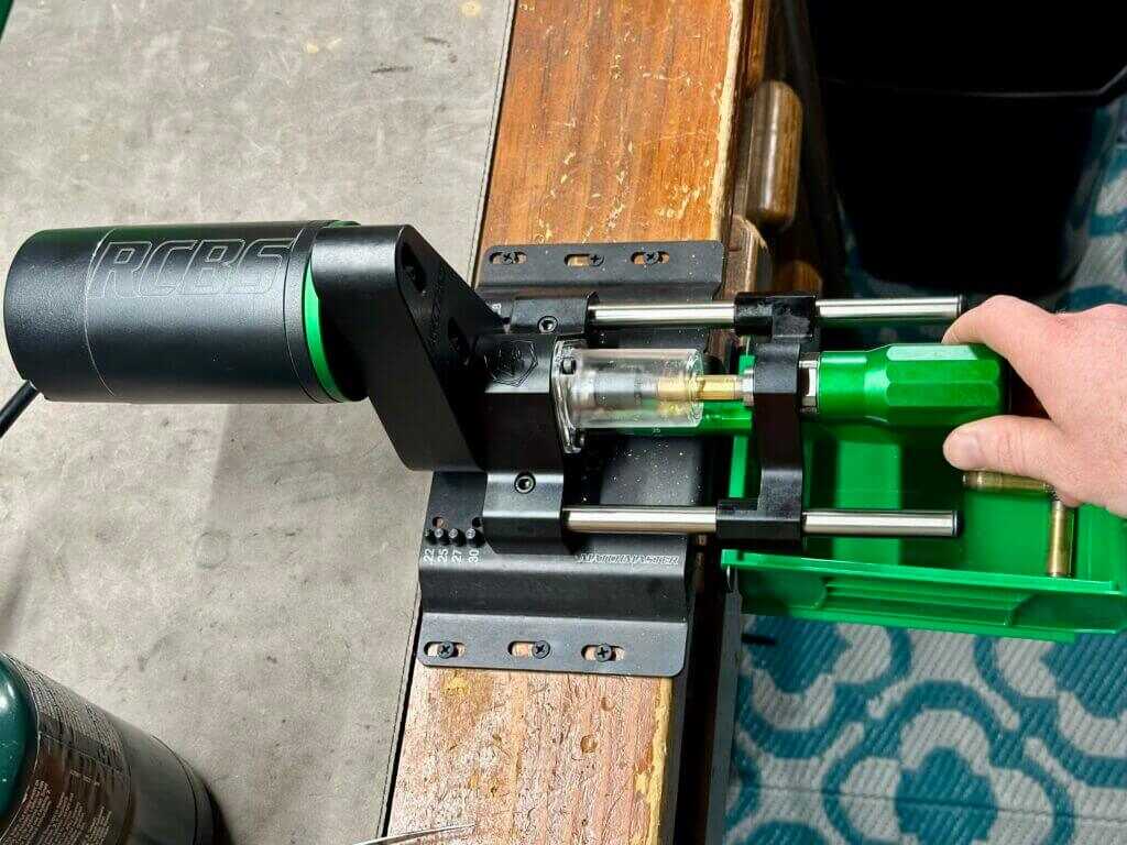 RCBS MatchMaster Precision Case Trimmer mounted directly to a reloading bench during use