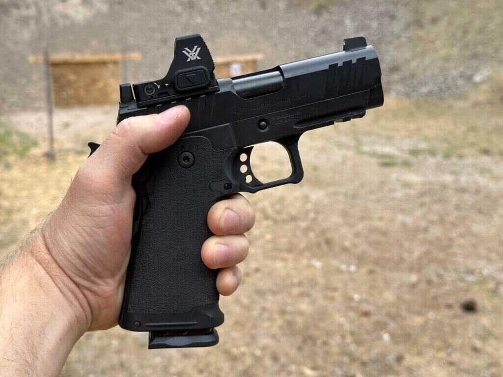 Shooter holding Springfield 1911 DS Prodigy 3.5 AOS during live-fire range testing