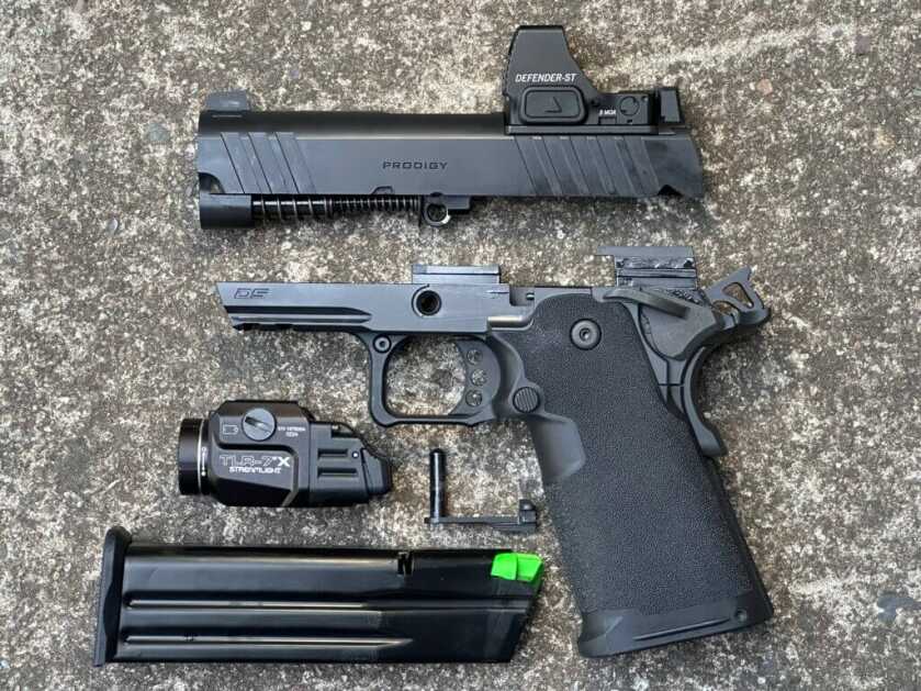 Disassembled Springfield 1911 DS Prodigy 3.5 AOS showing slide, frame, barrel, and recoil system