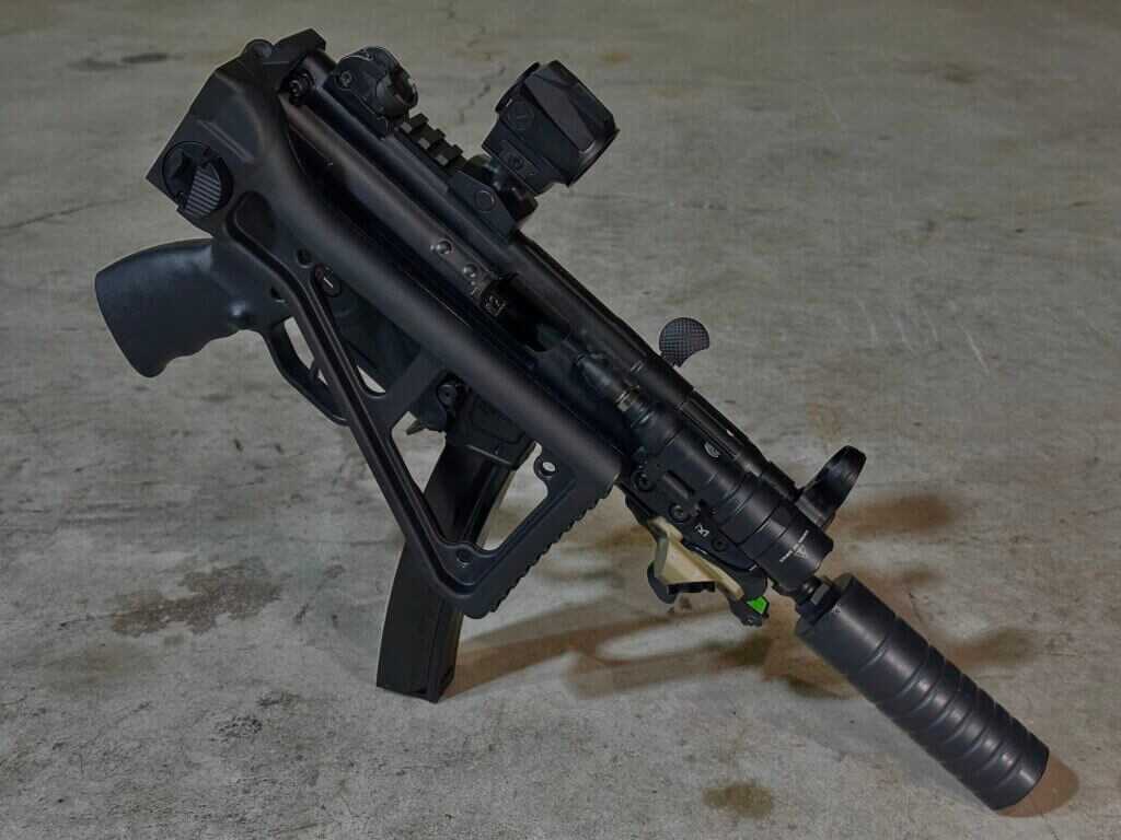SBR-configured PTR 9KT MP5K with B&T BT-20155 folding stock on concrete