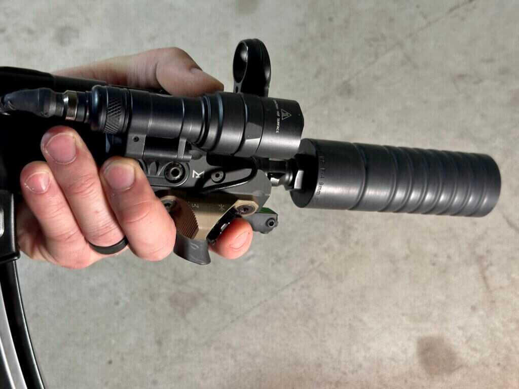 Close-up of PTR 9KT MP5K handguard controls with light, laser, and Unity Hot Button