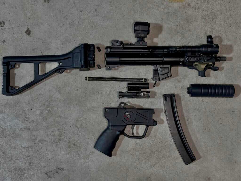 PTR 9KT MP5K clone field stripped to show the roller-delayed bolt and operating system