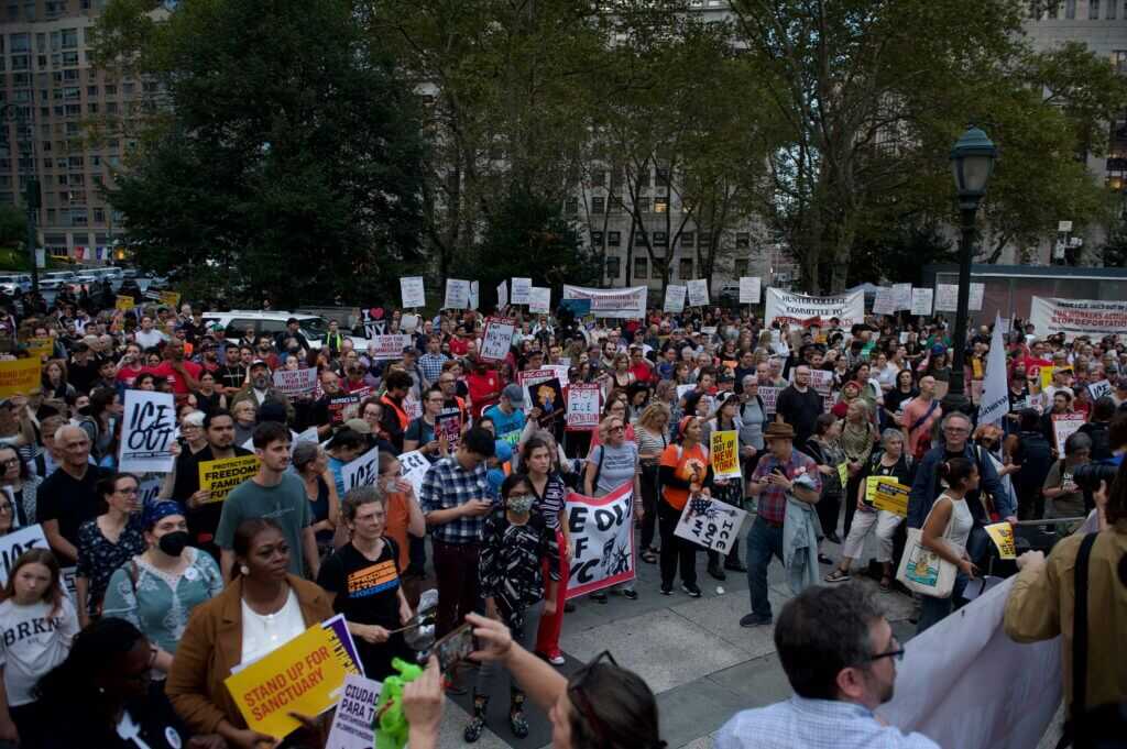 Modern immigration protest illustrating the citizenship debate surrounding Herschel Grynszpan's story