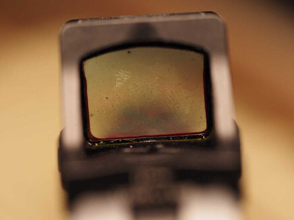 Kimber CDS9 red dot lens covered with carbon fouling after suppressed shooting