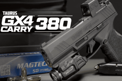 The Taurus GX4 Carry chambered in .380 Auto with a mounted red dot optic, weapon light, and ammunition displayed on a tabletop.