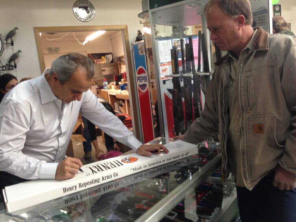 Anthony Imperato signing a Henry Repeating Arms rifle box for a customer